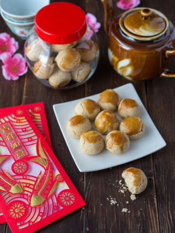 These traditional Chinese Peanut Cookies are sweet morsels of peanutty goodness that crumble and melt in your mouth. This popular Chinese New Year treat is so easy to make and irresistibly delicious.