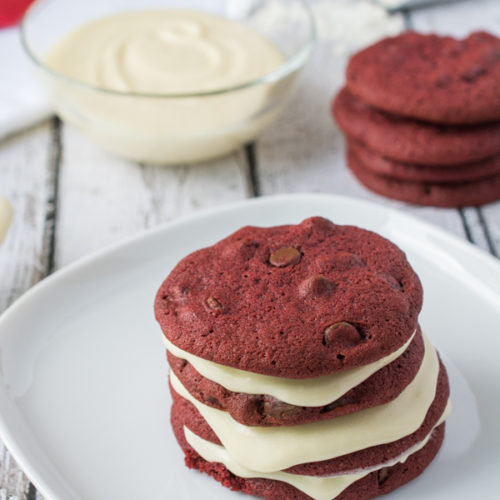 Red Velvet Cookies made with Cream Cheese Chips and filled with Cream Cheese  Frosting 🤤 Find the full recipe on my website, link in bio 🤎