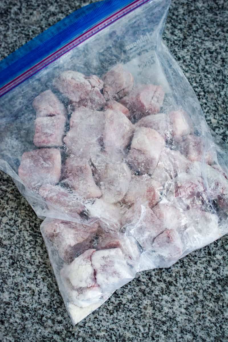 floured beef in a ziploc bag