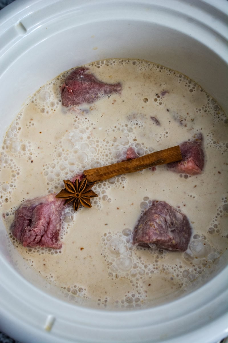 uncooked beef massaman in a crockpot